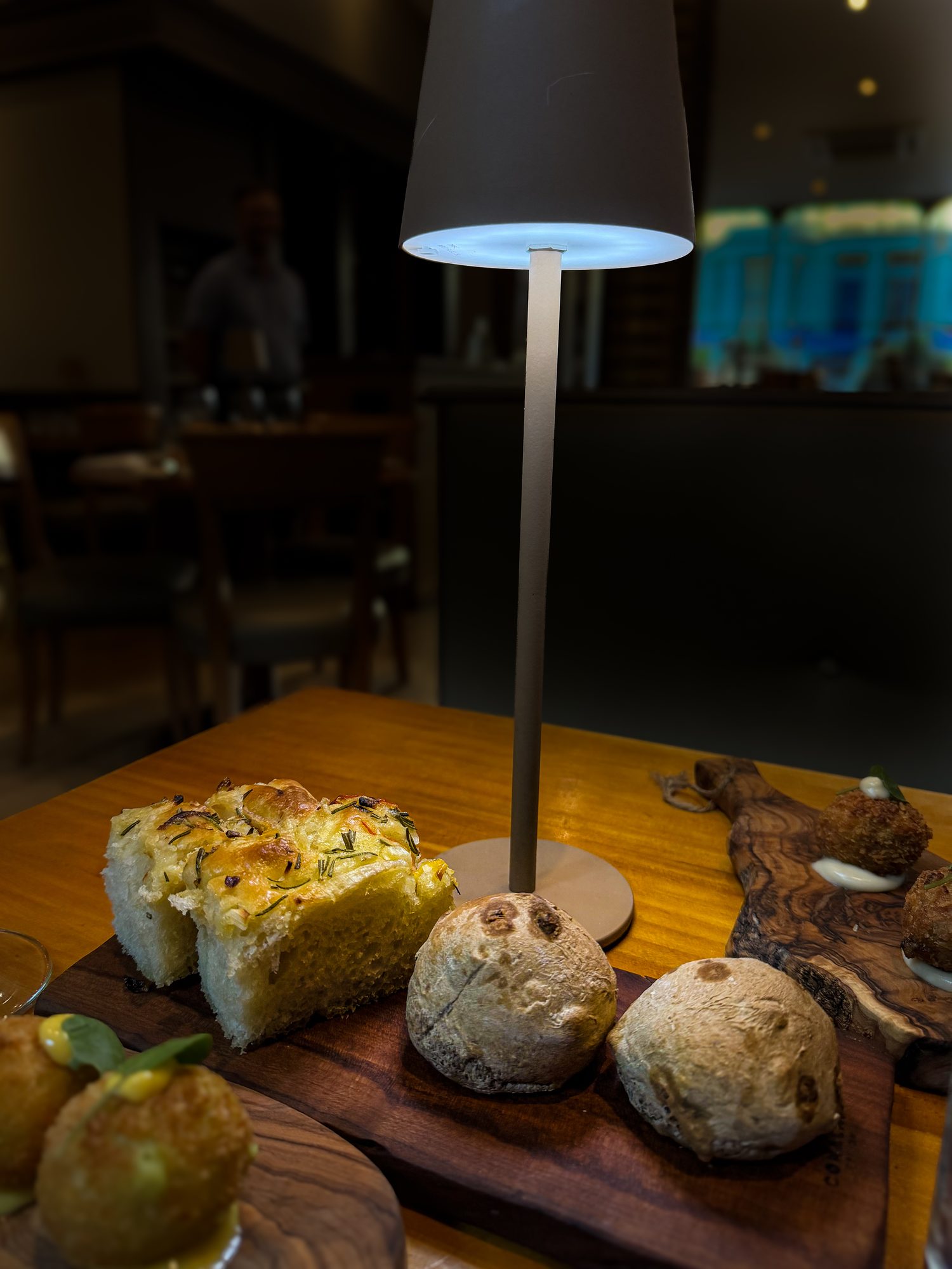 Rosemary focaccia, raisin and walnut rolls and croquettes with aioli