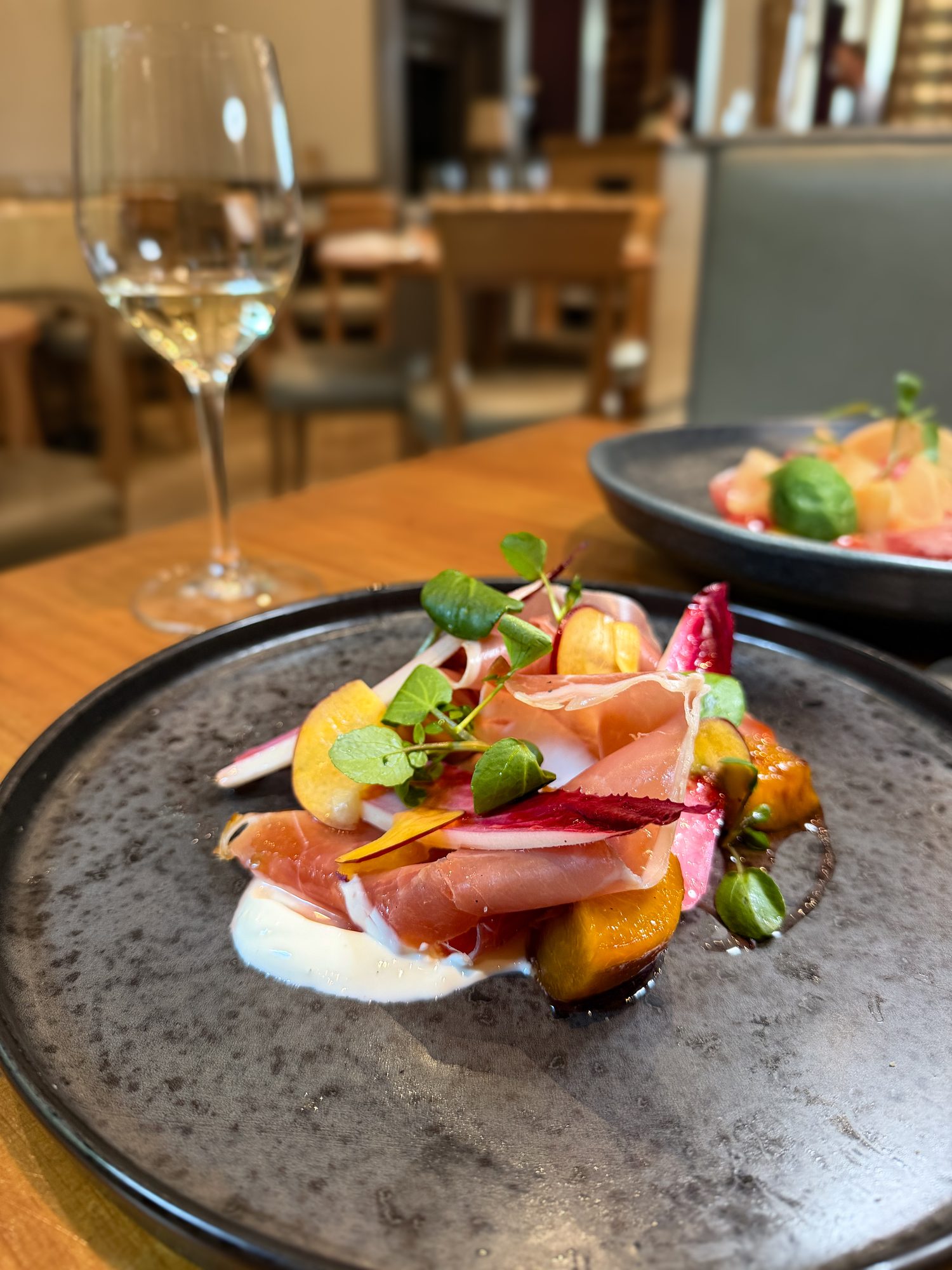 Prosciutto with balsamic peaches, labneh, watercress and pickled radish