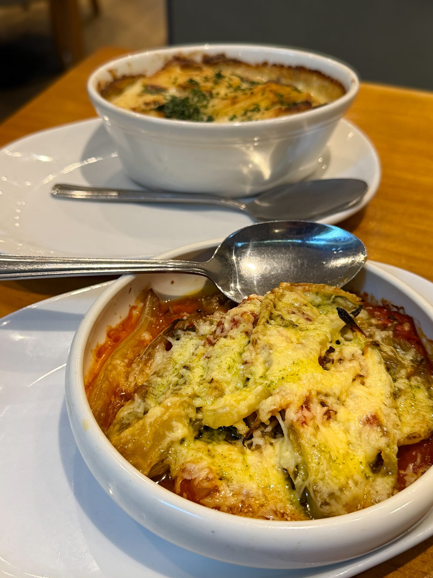 Fennel parmigiana baked in tomato and cheese, with potato dauphinois